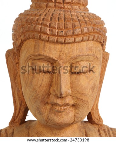 a wooden carving of Buddha