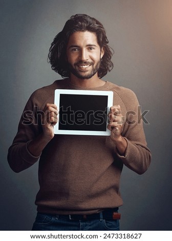 Tablet, mockup and man in studio for internet, search or communication advertising on grey background. App, website and creative designer for online, portrait and project promotion isolated and space