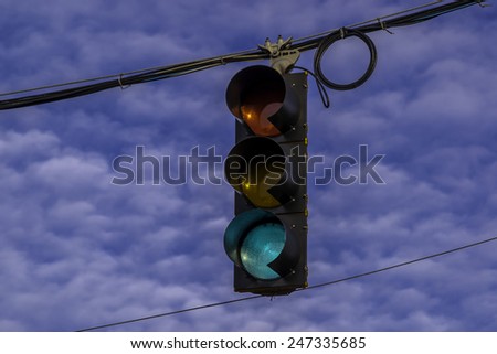 The hanging street light signal.
