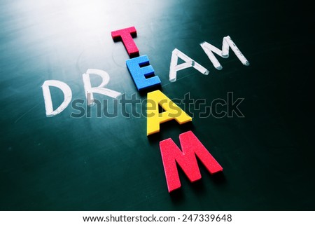 Colorful word team and writing word dream crossing on blackboard Royalty-Free Stock Photo #247339648