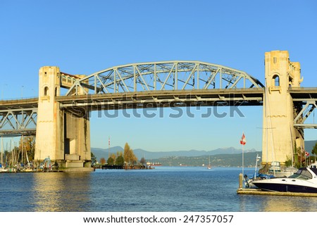 Vancouver Burrard Bridge is an Art Deco style bridge crossing False Creek between downtown Vancouver and Kitsilano, British Columbia, Canada.