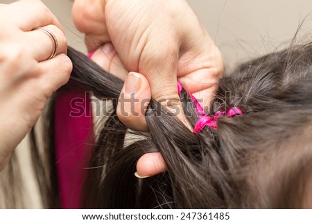 weave braids in a beauty salon