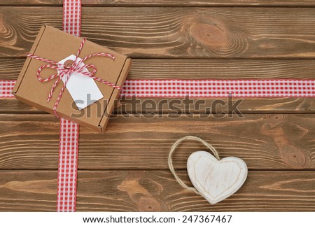 box and ribbon on a brown background
