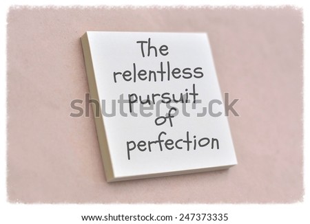 Text the relentless pursuit of perfection on the short note texture background
