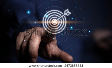 Business goal and target success concept, businessman touching dartboard sign virtual goal to achievement Business and finance, e-commerce strategy planning on online marketing future.