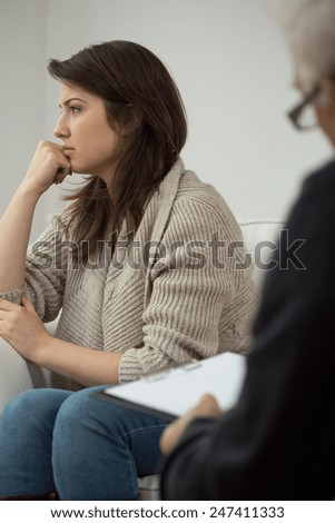 Photo of unhappy young woman on therapy