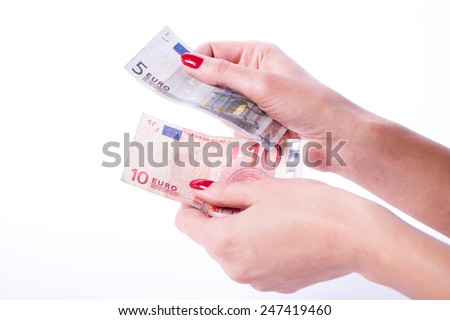 Woman hands with red manicure holding banknotes of euro