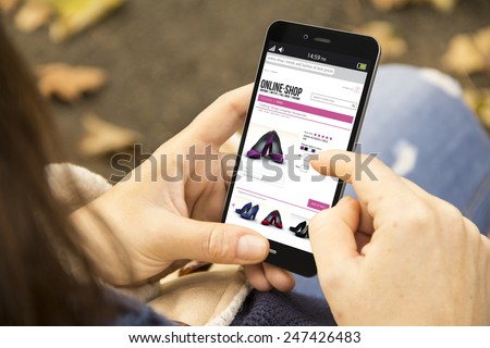 business and modern lifestyle concept: young woman shopping online at the park Royalty-Free Stock Photo #247426483