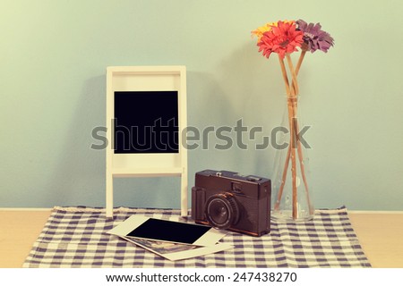 Vintage camera, Flower and  photo the memory on table