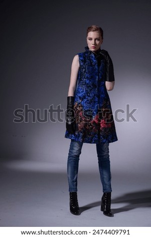Full body Fashion model Posed on gray
background in fashion clothes 
