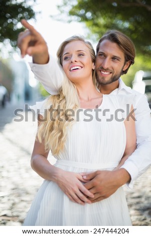 Attractive couple spending time together on a sunny day in the city