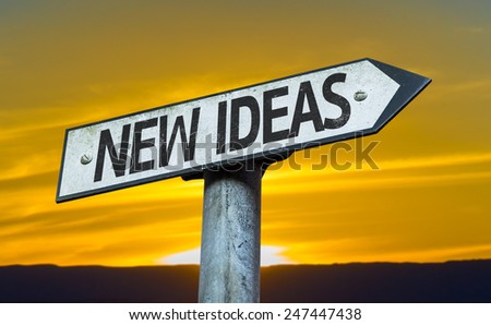New Ideas sign with a sunset background