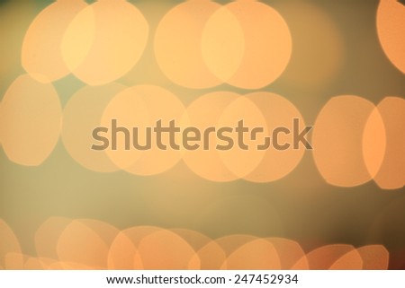 Gold Festive Christmas background. Elegant abstract background with bokeh defocused lights and stars 