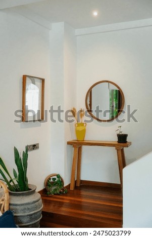 Minimalist indoor corner with wooden accents and plants