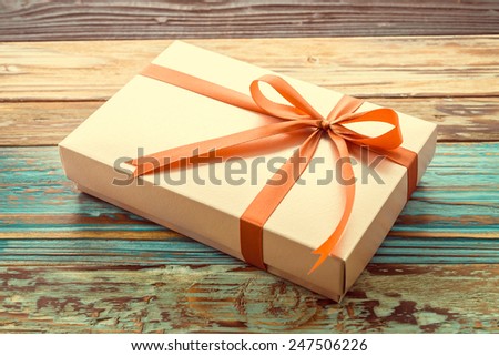 Gift box on wooden background - vintage effect style pictures