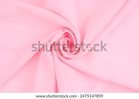 Crumpled surface of soft light pink fleece texture as background.