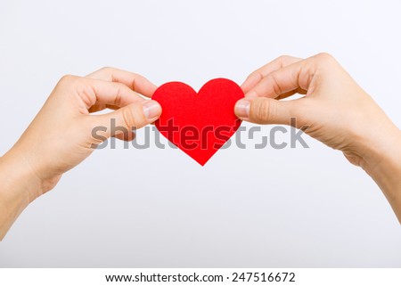 Hands with paper heart