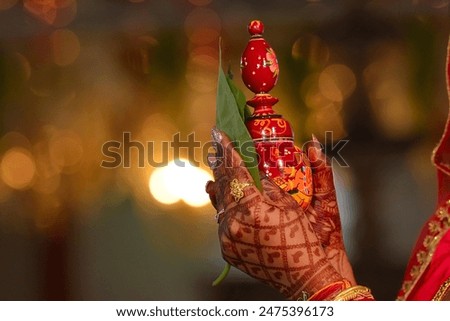 "Gachkouto," a quintessential Bengali tradition, symbolizes purity and auspiciousness, often seen in Bengali weddings.