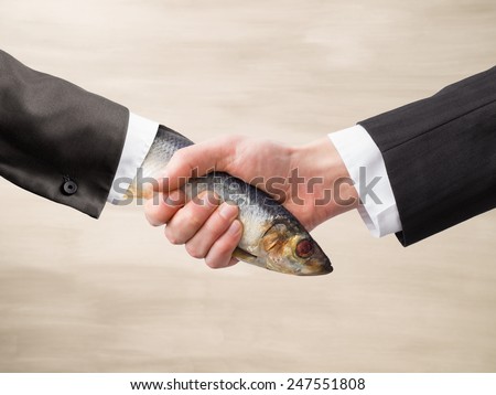 Dead Fish Handshake Royalty-Free Stock Photo #247551808