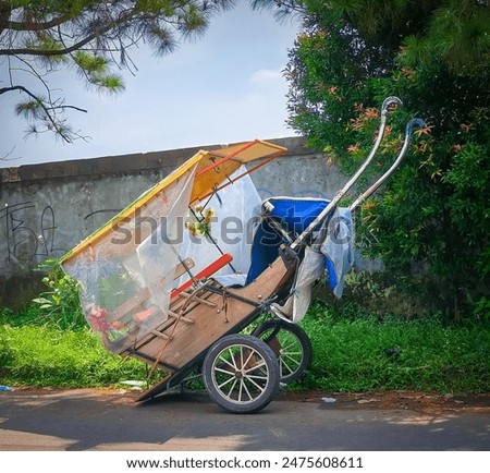 The horse cart parked on the side of the road is well maintained