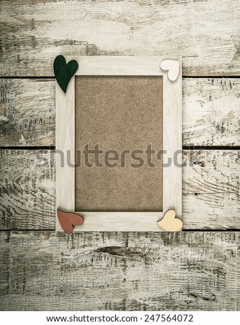 wooden photo frame with Valentine's symbol