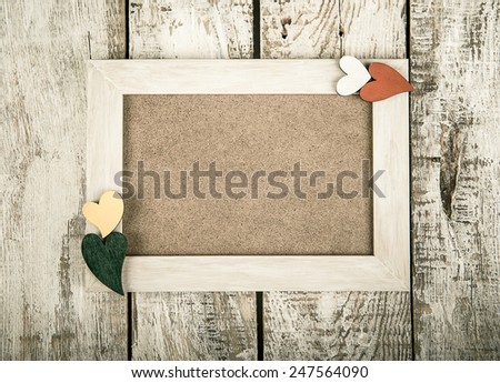 wooden photo frame with Valentine's symbol