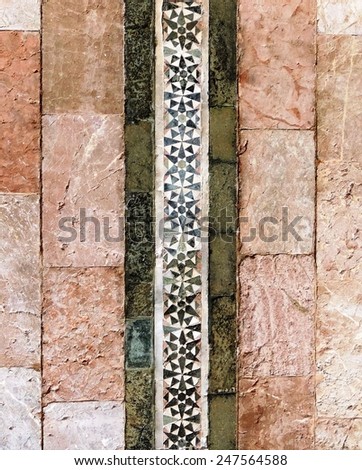 Stone wall decorated with mosaics
