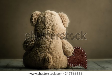 toy teddy bear with a symbol Valentine