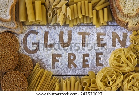 gluten free word with wood background Royalty-Free Stock Photo #247570027