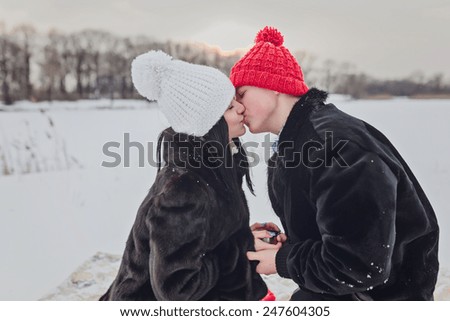 Young  happy smiling couple in love. Winter