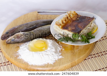 Piece of fish cake, flour, egg and saffron cod