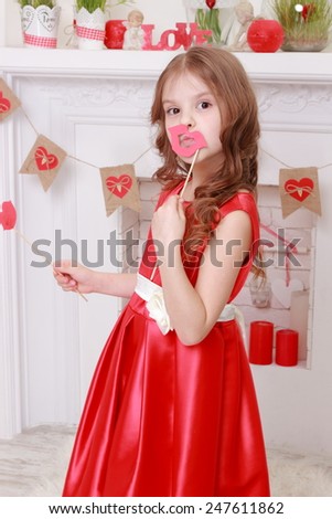 Image of beautiful little girl in red dress over valentine day background