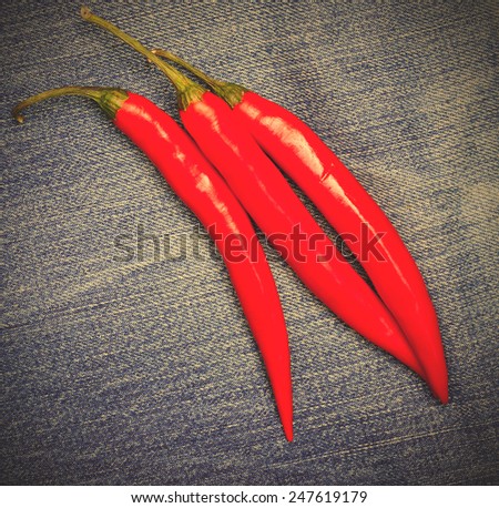 red hot chili pepper on jeans background. instagram image style