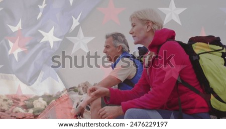 Image of flag of united states of america over senior couple taking break hiking in mountains. american history, patriotism and independence concept digitally generated image.
