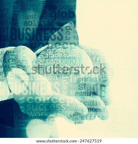 Businessman holding glass globus