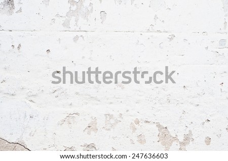 white old brick wall with breakaway plaster