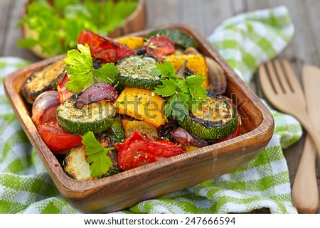Grilled vegetables  salad with zucchini, eggplant, onions, peppers and tomato Royalty-Free Stock Photo #247666594