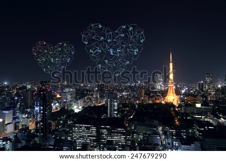 heart sparkle Fireworks celebrating over Tokyo cityscape at night, Japan