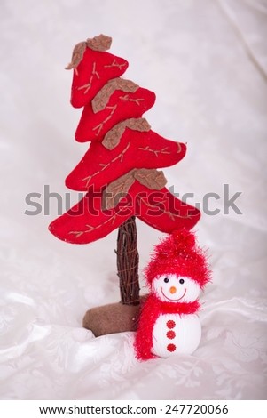 Little toy snowman with tree