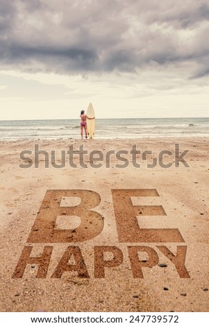 Calm woman in bikini with surfboard on beach against be happy