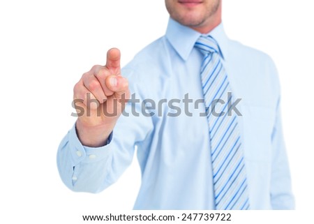 Businessman in shirt pointing with his finger on white background