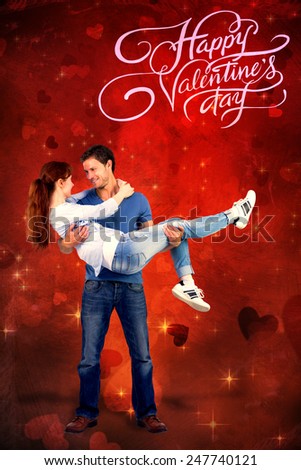Man lifting up his girlfriend against valentines heart design