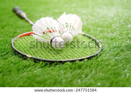 Shuttlecock and badminton racket Royalty-Free Stock Photo #247751584