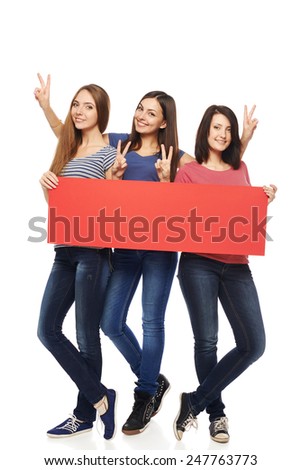Women billboard sign. Fill length of three excited women showing blank red placard and gesturing V sign, over white background