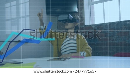 Image of graphs over grid pattern over asian woman wearing vr headset and gesturing in office. Digital composite, multiple exposure, report, business, growth and technology concept.