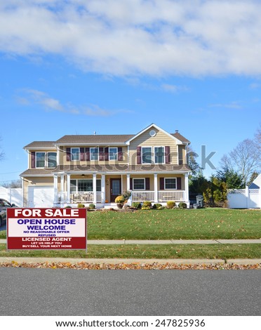 Real Estate for sale open house welcome sign front yard curb of McMansion autumn day blue sky clouds residential neighborhood USA