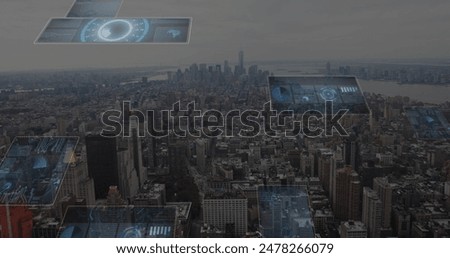 Image of round scanners and data processing against aerial view of cityscape. Computer interface and business technology concept