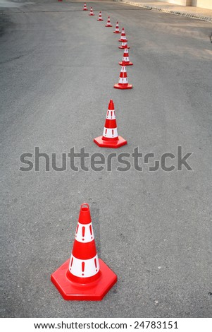 An image of cautions on asphalt road