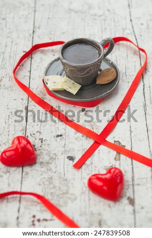 Gray cup of coffee with some sweets and Good morning note, for the St Valentine's day