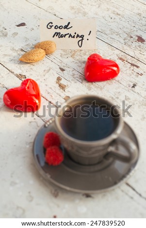 Gray cup of coffee with some sweets and Good morning note, for the St Valentine's day